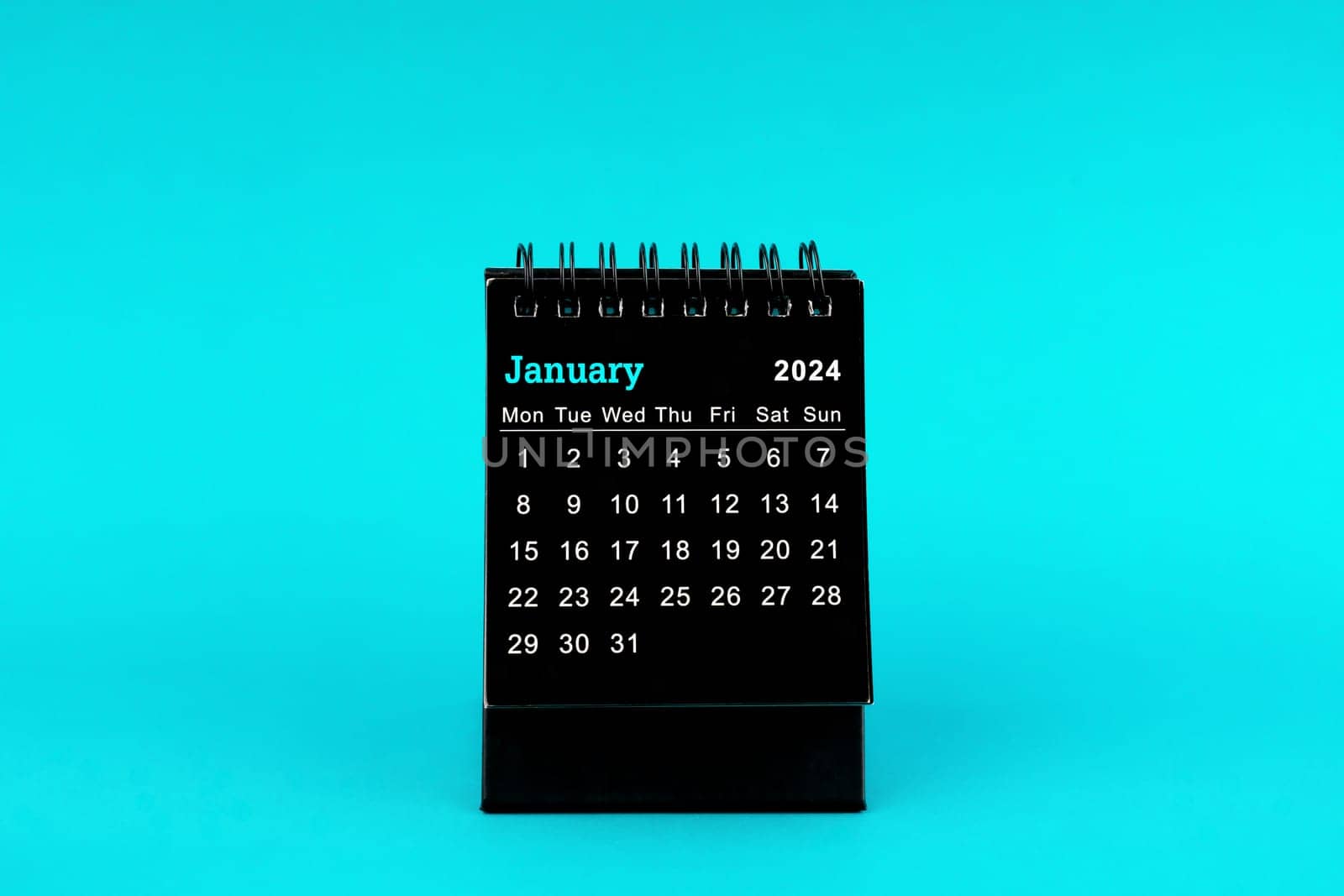 Black Calendar for January 2024. Desktop calendar on a green color background.