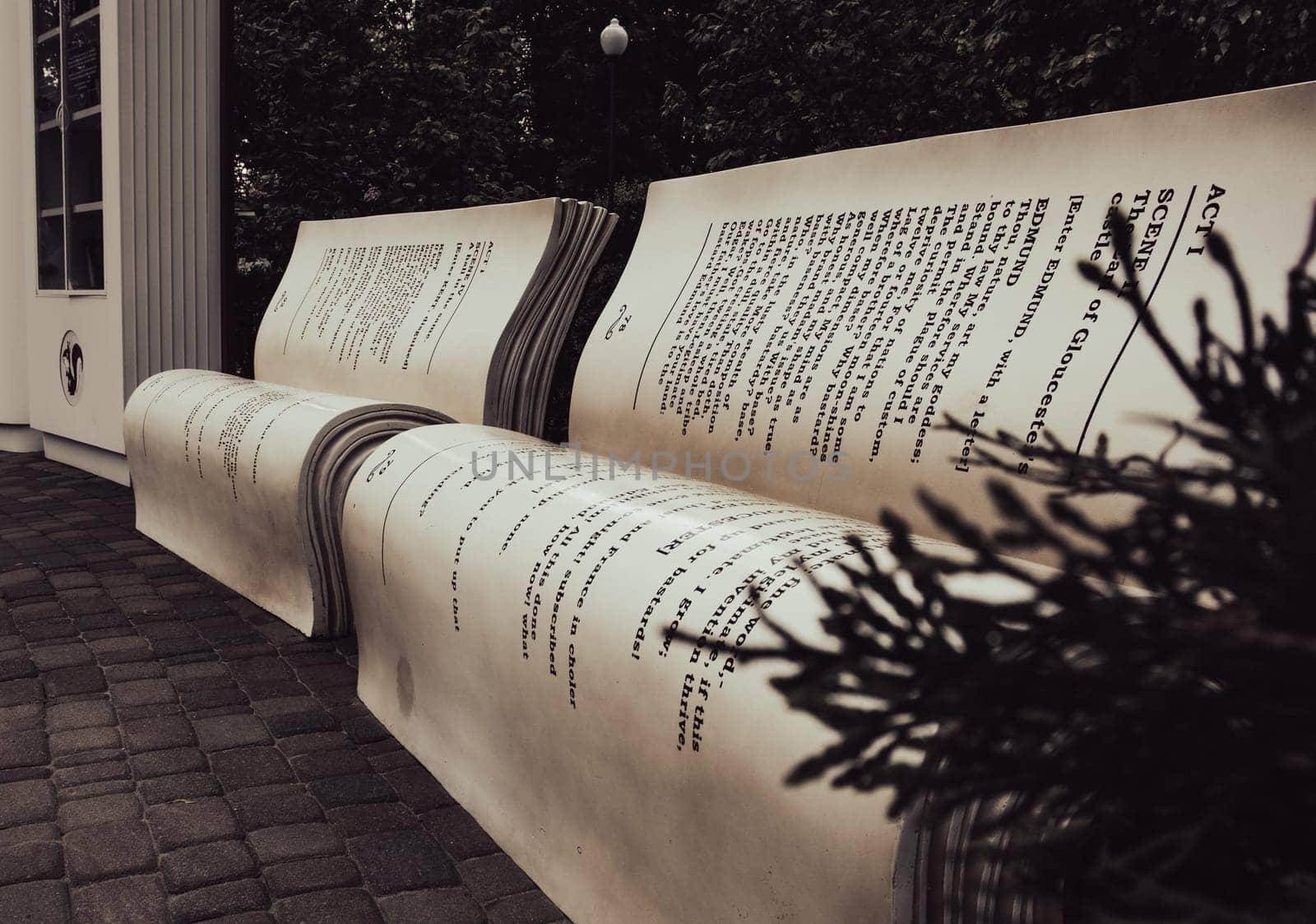 Modern bench in a city park on a sunny day. Bookcrossing zone by _Nataly_Nati_