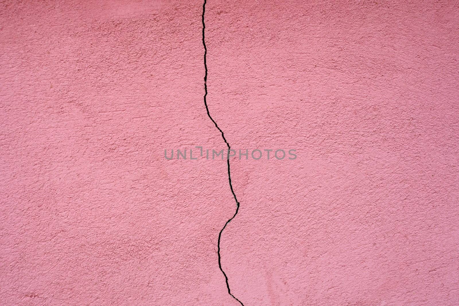 Pink wall with cracks, texture as background for design by darksoul72