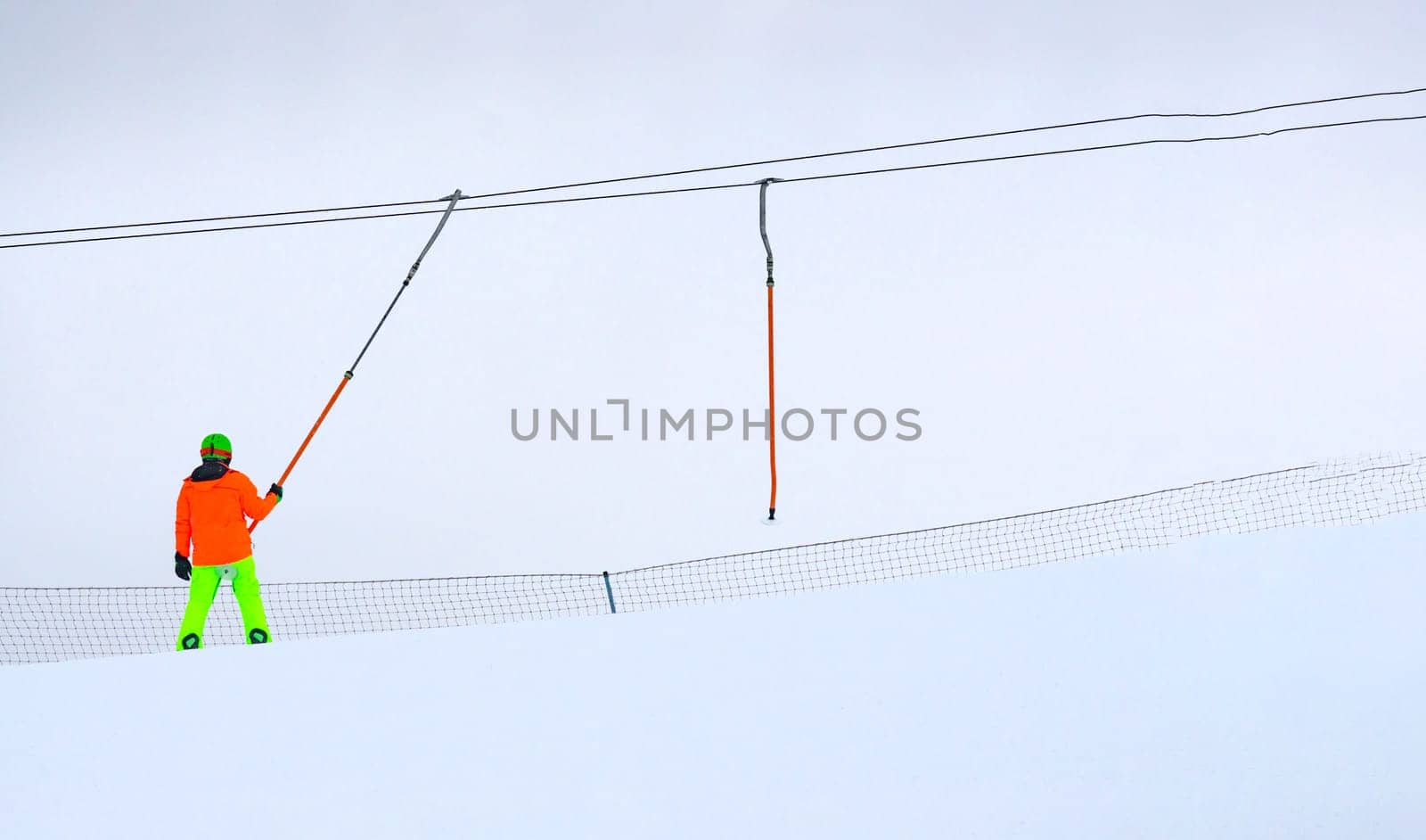 Person skiing down a slope, winter entertainment, winter time. Copy space. Selective focus