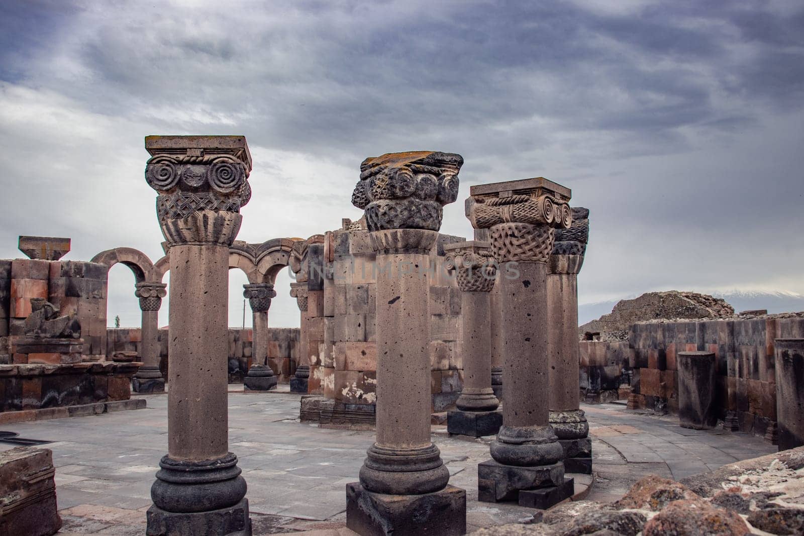 View of ancient column in Zvartnos temple in Armenia concept photo. Beautiful old church scenery photography. High quality picture for magazine, article