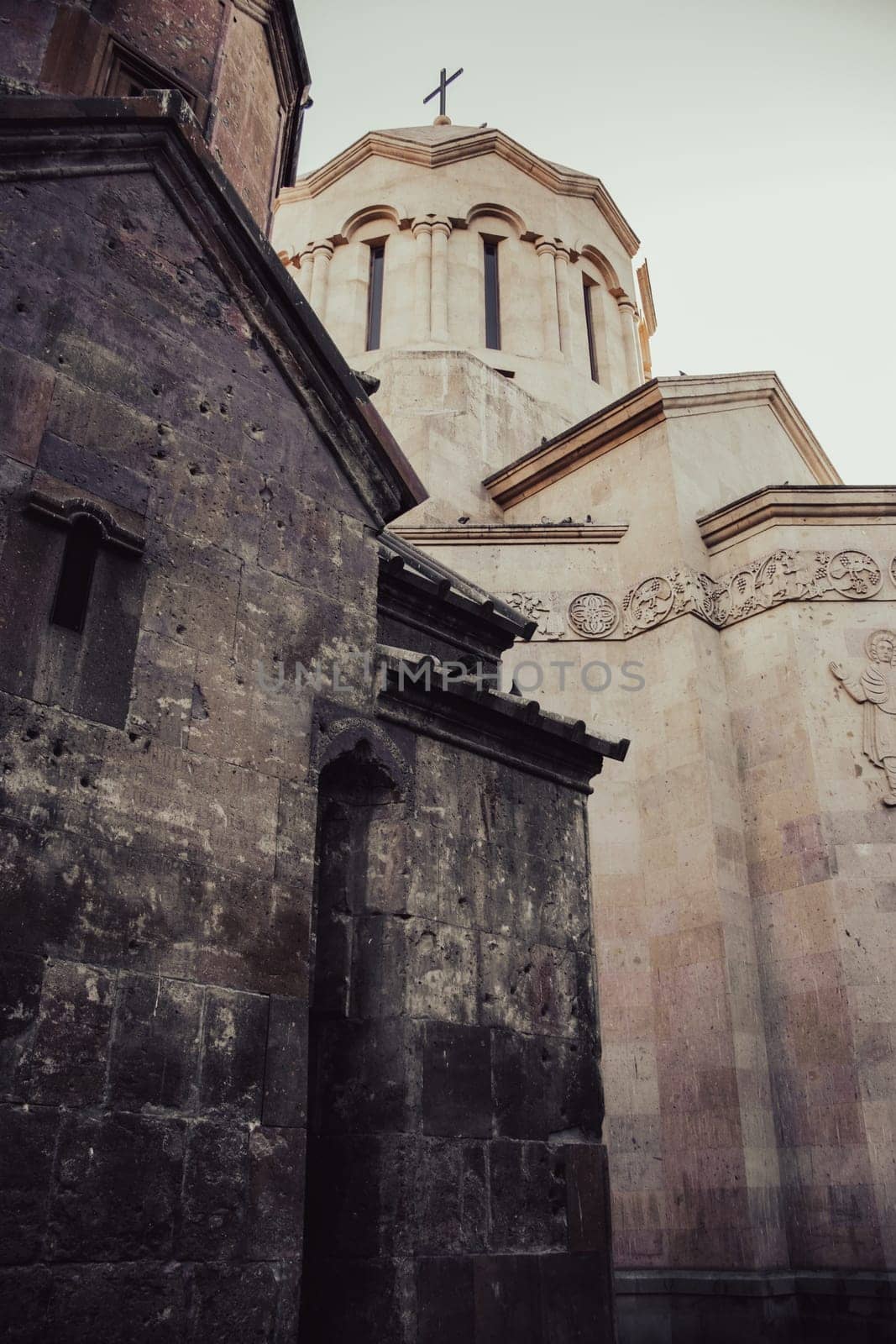 Ancient church walls with spires cityscape concept photo. Street scene of Yerevan city. High quality picture for wallpaper