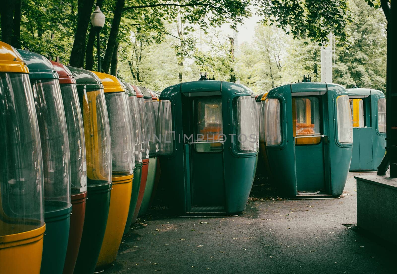 Abandoned funicular vehicle during the war in Central Park, Kharkiv, Ukraine. Street scene, parkland. High quality picture for wallpaper, travel blog.