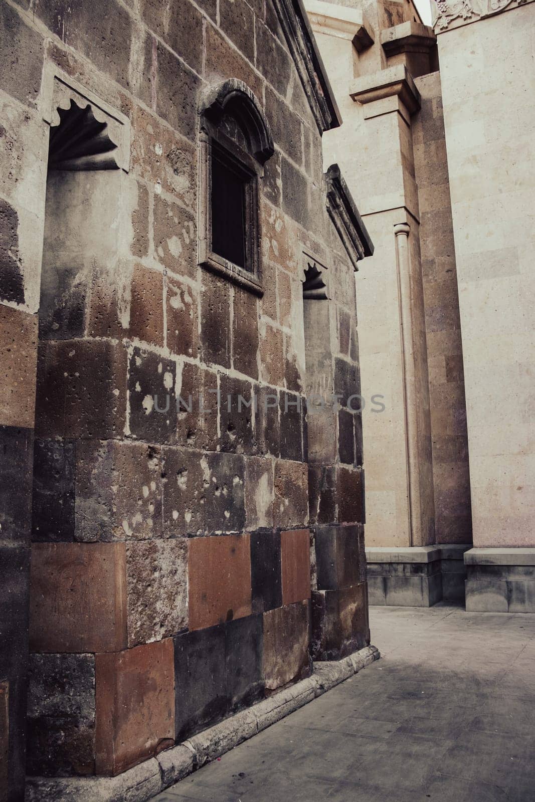 Ancient church walls with windows cityscape concept photo. Street scene of Yerevan city. High quality picture for wallpaper
