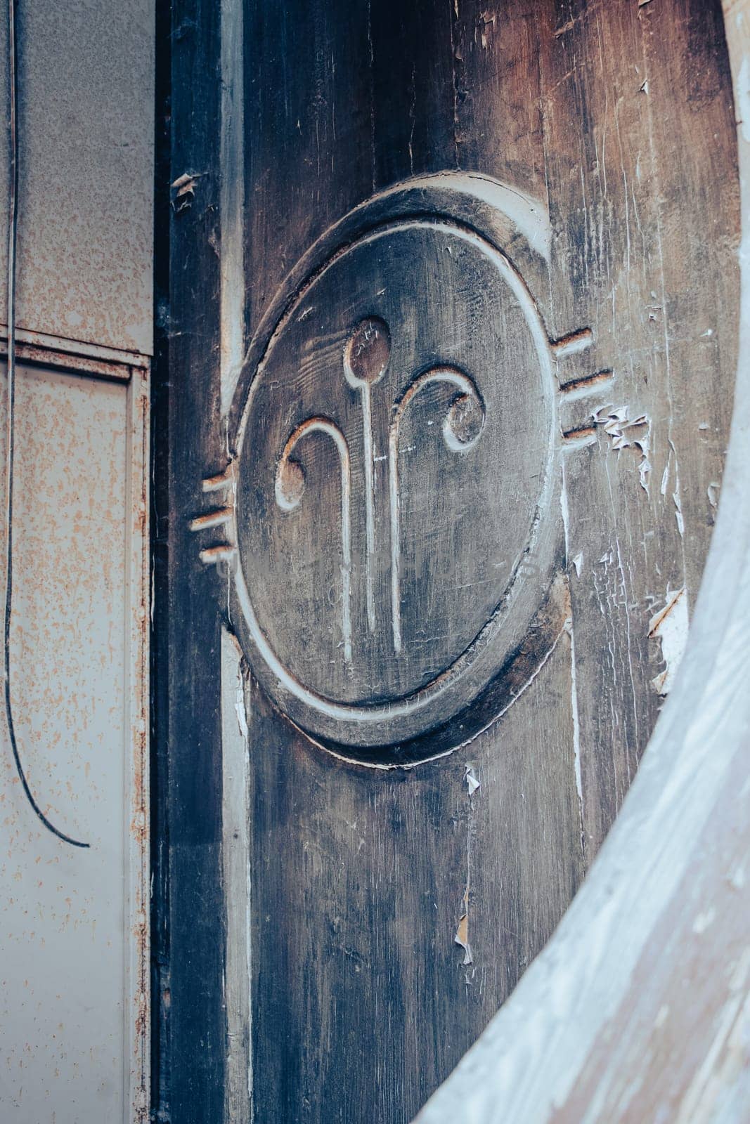 Close up decorative element of a wooden door concept photo. Urban architectural photography. High quality picture of historical building element