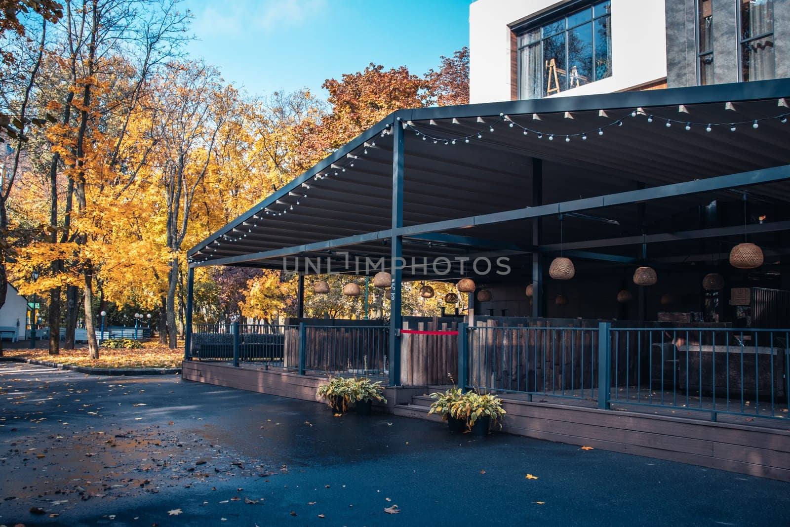 Street view with cafe terrace in the autumn concept photo by _Nataly_Nati_