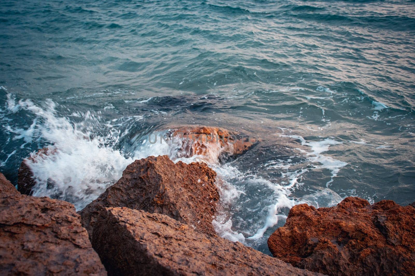 Seaside near Barcelona close up concept photo. Water with stones on the beach. Underwater rock. by _Nataly_Nati_