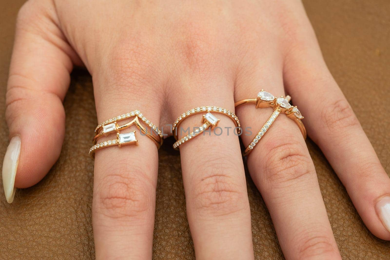 Expensive luxury jewelry rings on womans hand by paulvinten