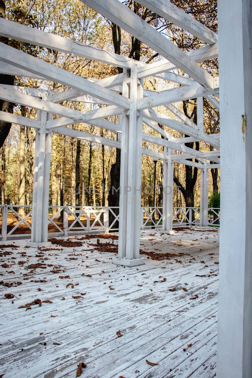 Close up view of the wooden gazebo house in park concept photo. Urban city life. Parkland of European town. High quality altanka picture for wallpaper