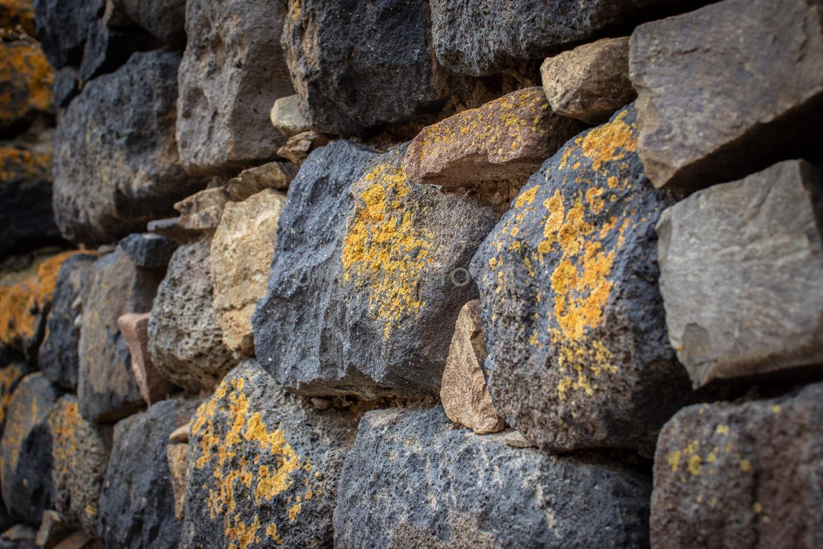 Close up yellow lichen cover the rough stone wall concept photo. by _Nataly_Nati_