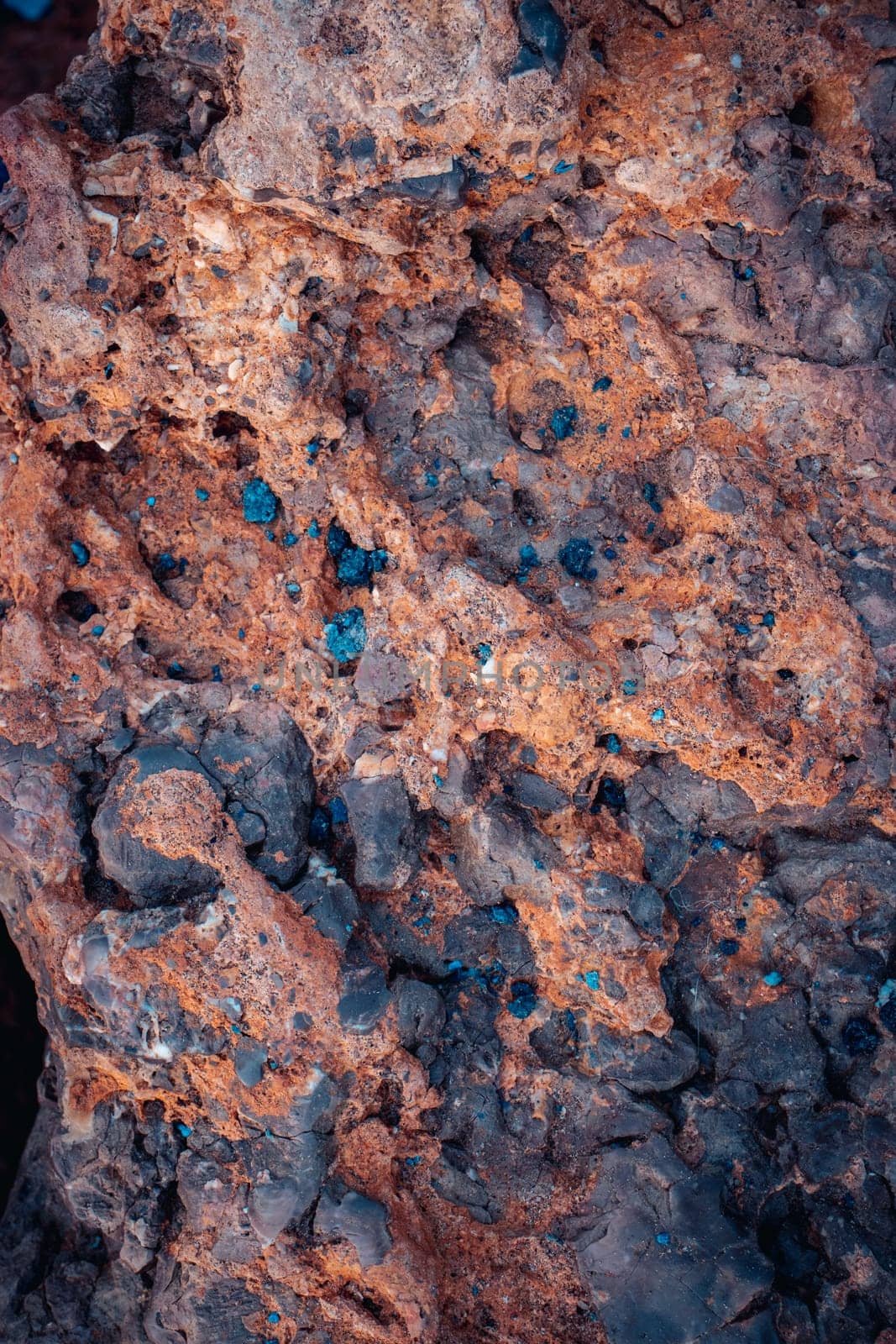 Red textured rock background photo. Close-up blue scattered in the stone. Sandstone by _Nataly_Nati_