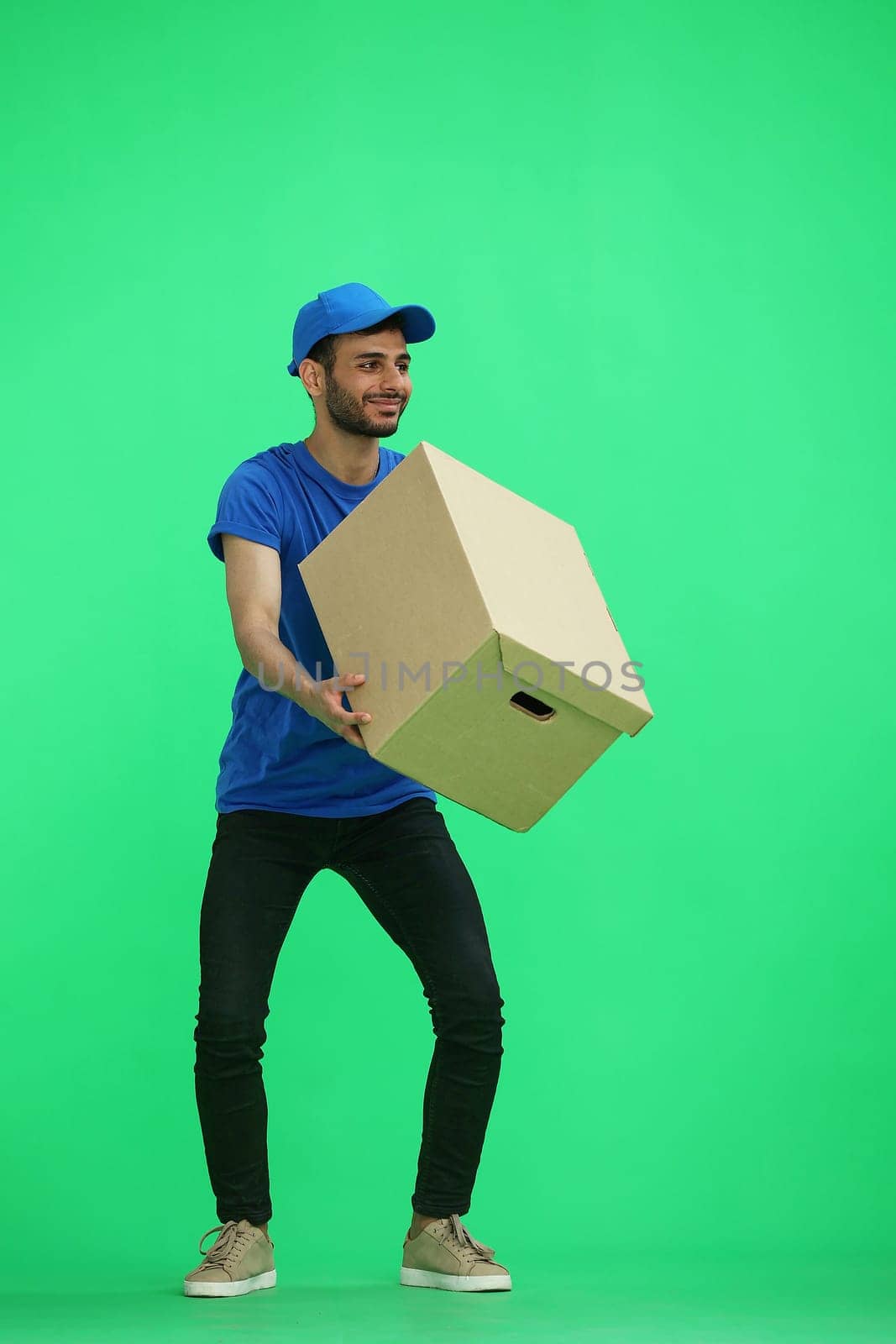 A man on a green background with box.