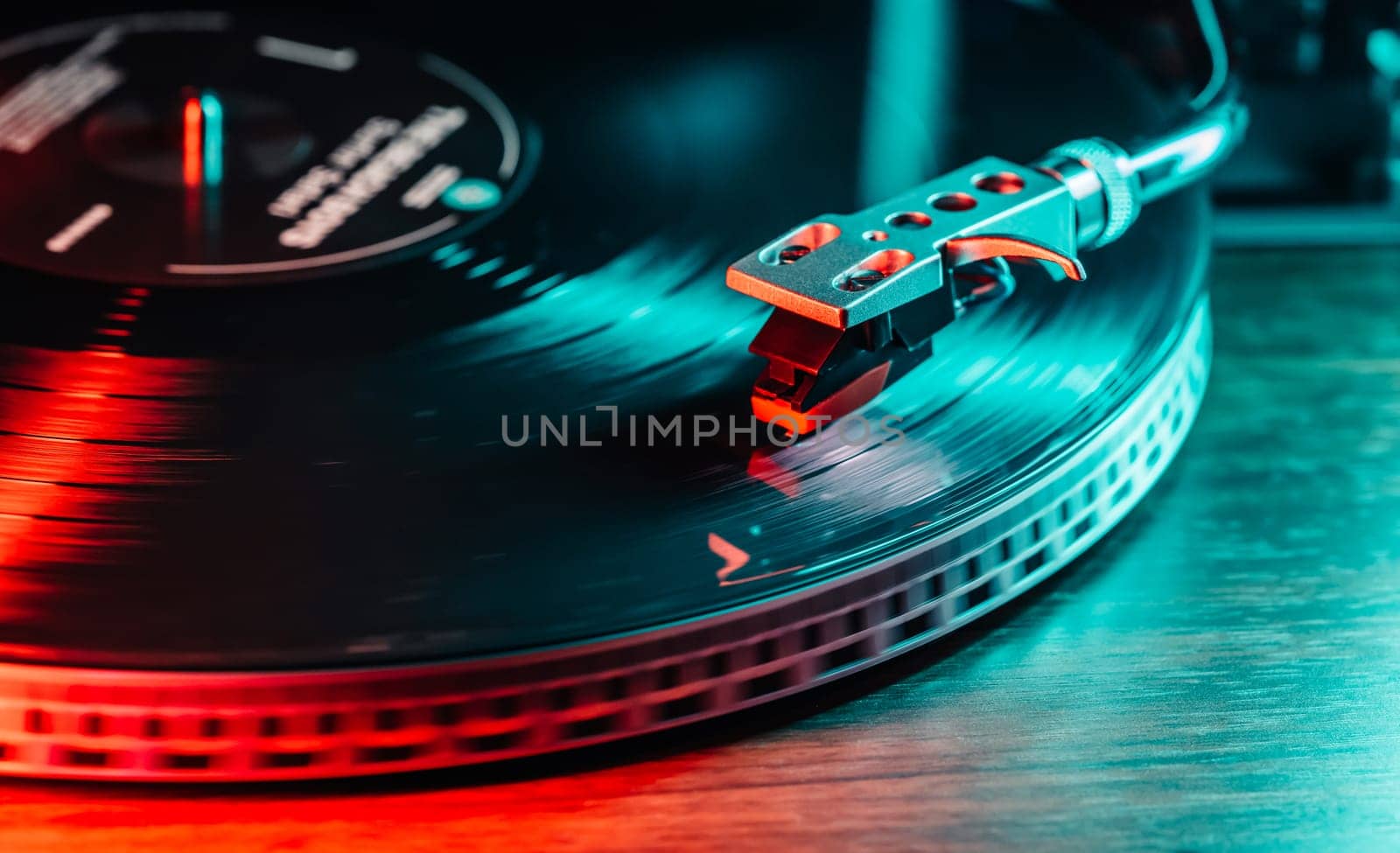 Colored neon vinyl record playing. Fusion of retro vibes and vibrant modernity. Contemporary aesthetics. Close-up dynamic motion. . High quality