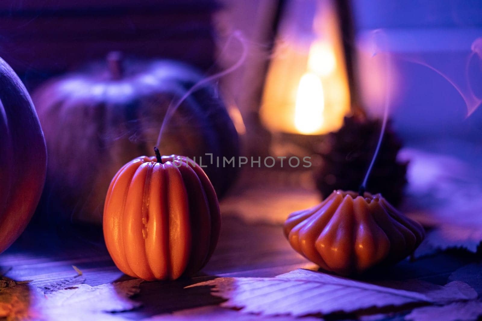 Melancholic beauty of autumn, extinguished pumpkins, cone candles on windowsill, wistful charm of fall season, touch of poetic ambience, autumnal nostalgia and reflection.