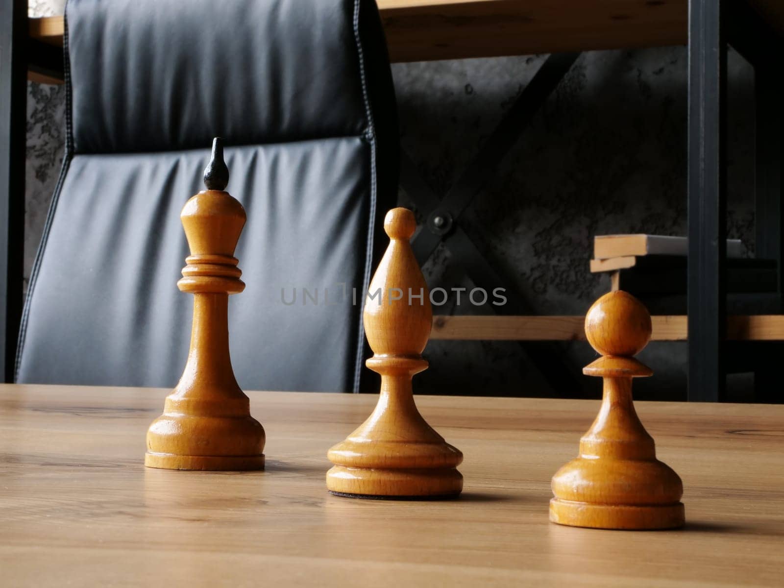 Chess pieces with king as a symbol of succession planning and hierarchy.