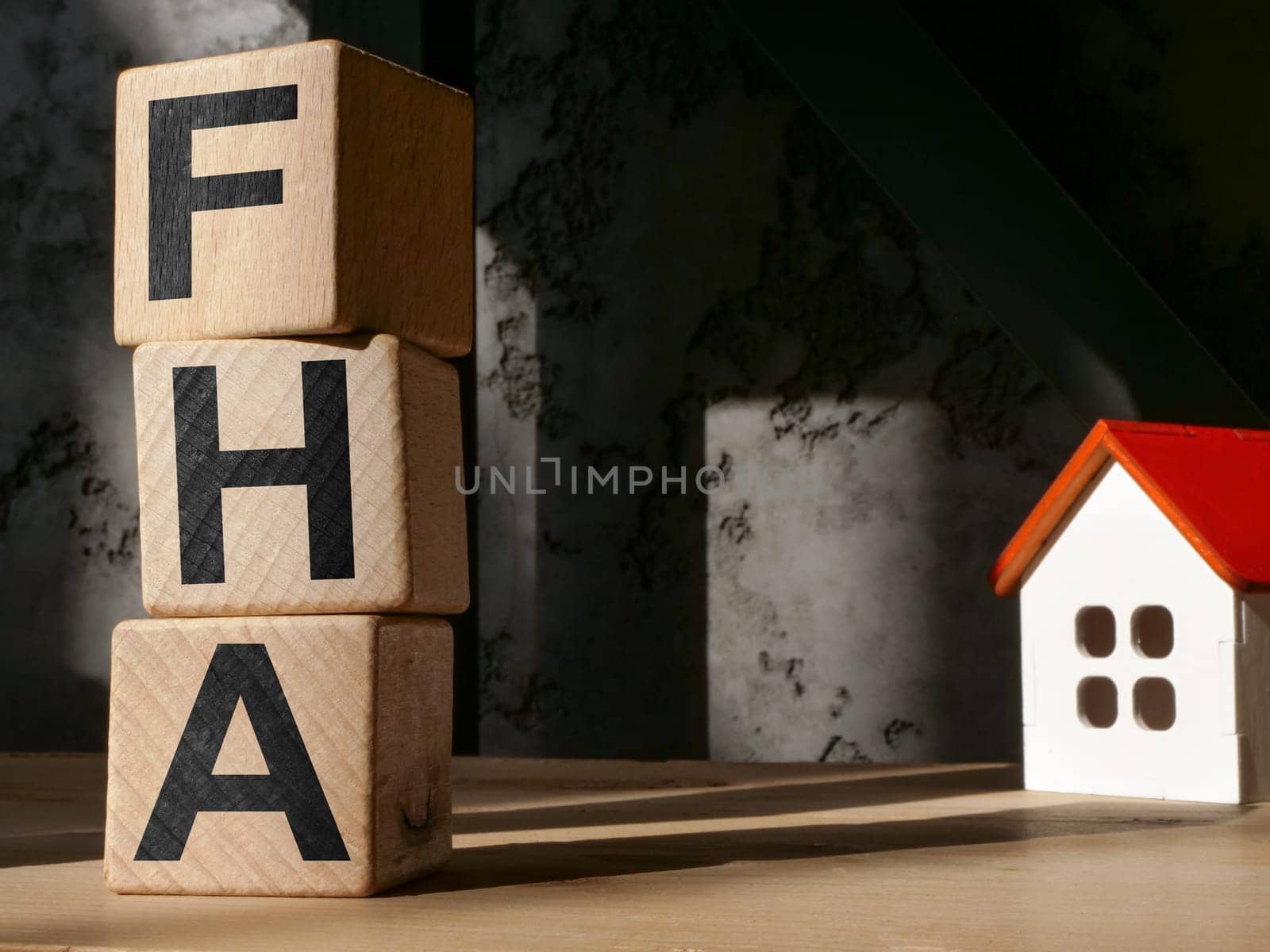 Model of house and letters FHA Federal Housing Administration. by designer491