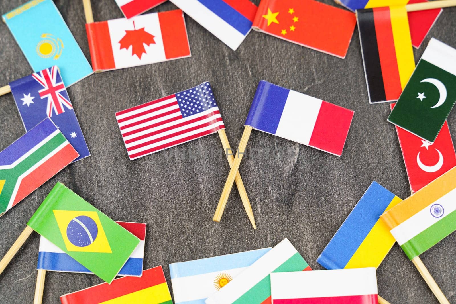 Policy. National flags of different countries. The concept is diplomacy. In the middle among the various flags are two flags - USA, France
