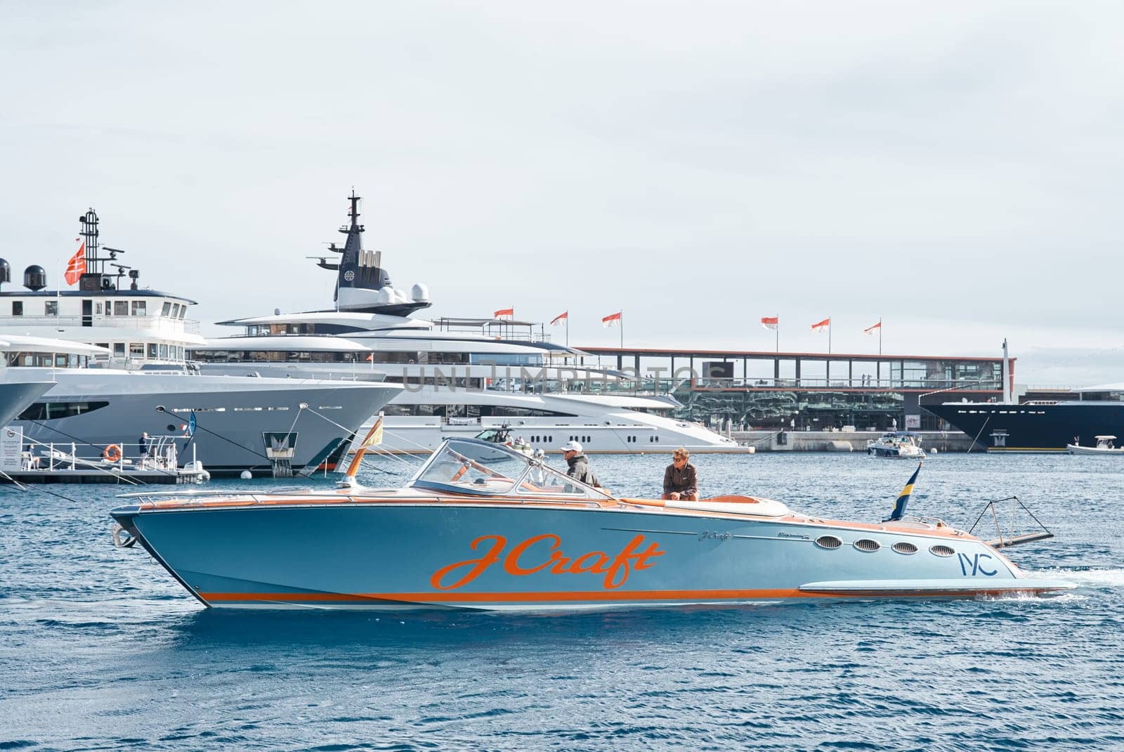 Monaco, Monte Carlo, 29 September 2022 - Water taxi by luxury motorboat on the famous yacht exhibition, a lot of most expensive luxury yachts, richest people, yacht brokers, boat traffic by vladimirdrozdin