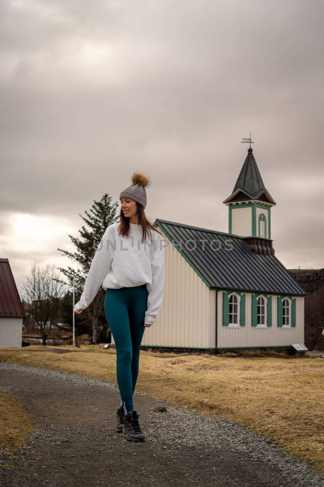 Woman with woolen hat in a church in Thingvellir, Iceland