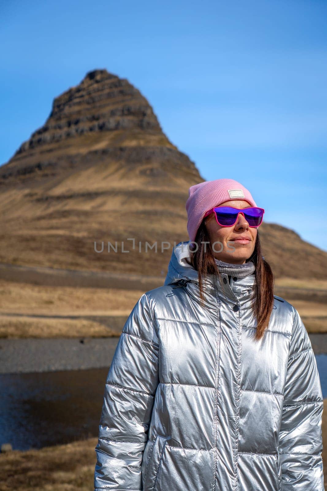 Woman with metallic jacket in Kirkjufell, Iceland
