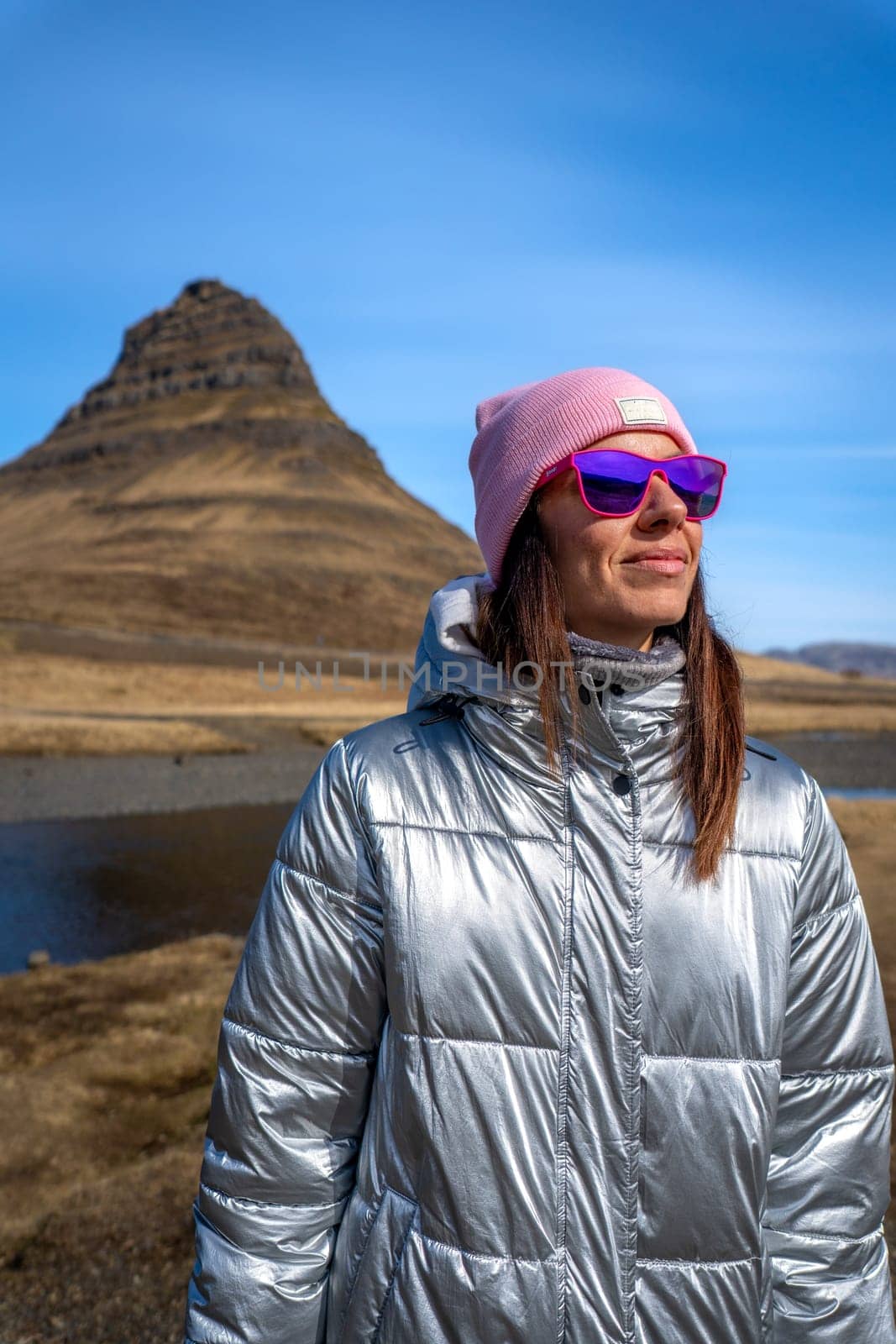 Woman with metallic jacket in Kirkjufell, Iceland