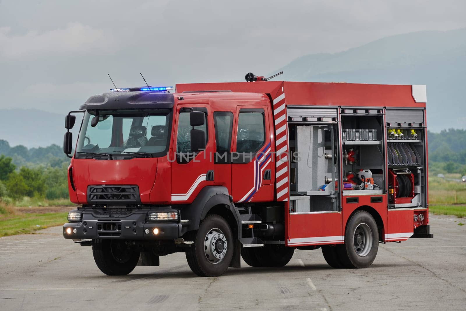 In this captivating scene, a state-of-the-art firetruck, equipped with advanced rescue technology, stands ready with its skilled firefighting team, prepared to intervene and respond rapidly to emergencies, ensuring the safety and protection of the community by dotshock