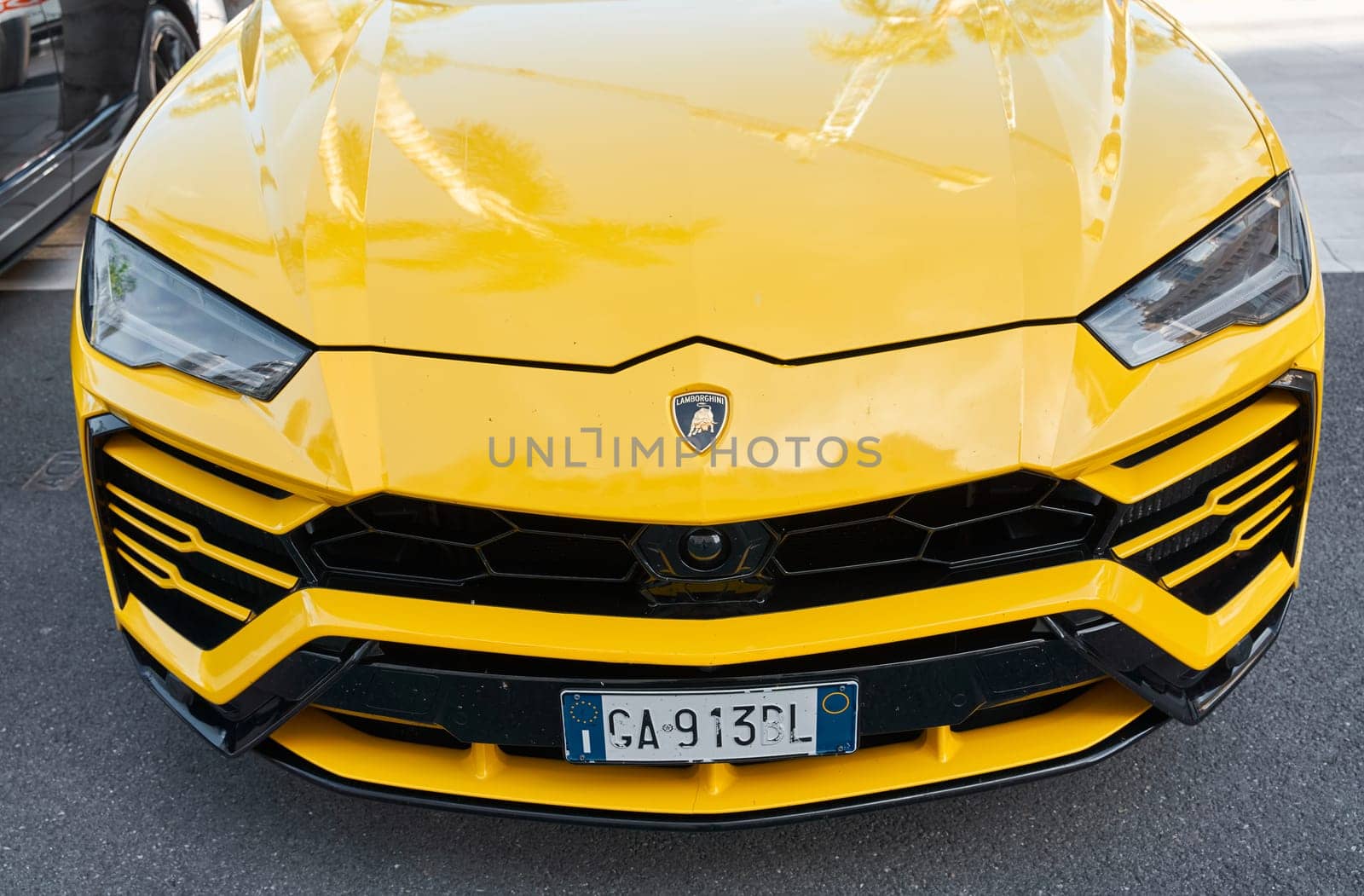 Monaco, Monte Carlo, 29 September 2022 - Close-up view of yellow sports car Lamborghini on street. High quality photo