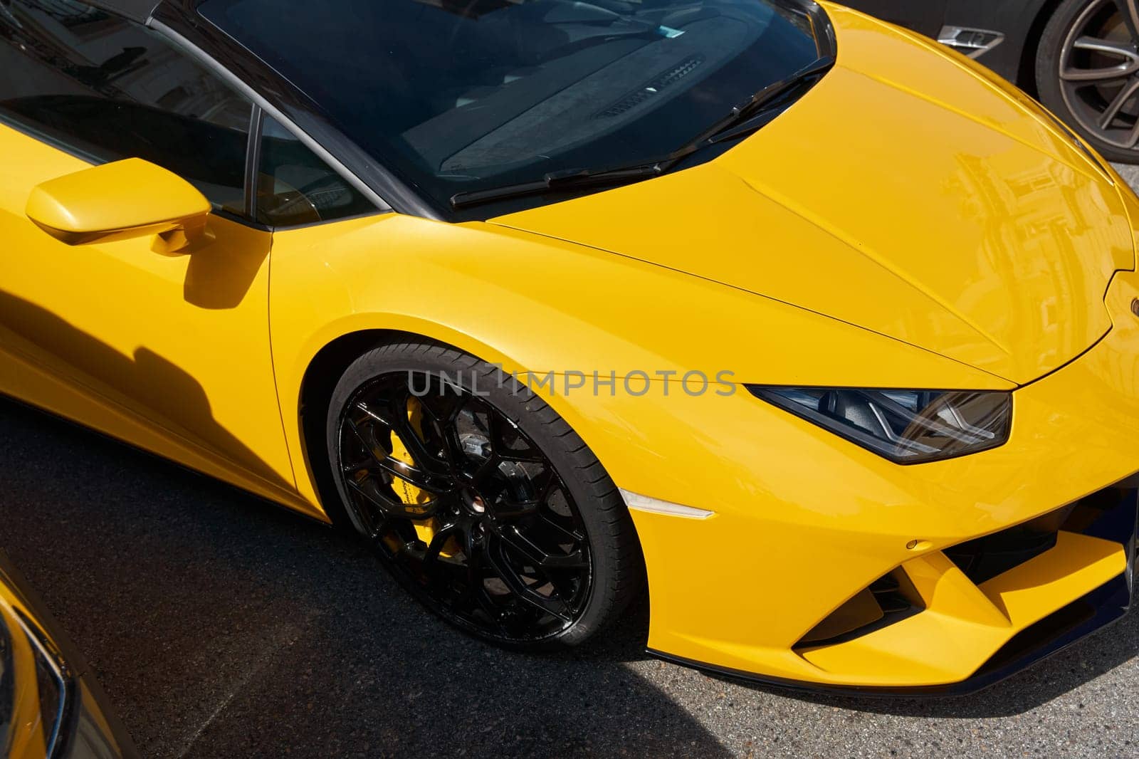 Monaco, Monte Carlo, 29 September 2022 - Close-up view of yellow sports car Lamborghini on street. High quality photo