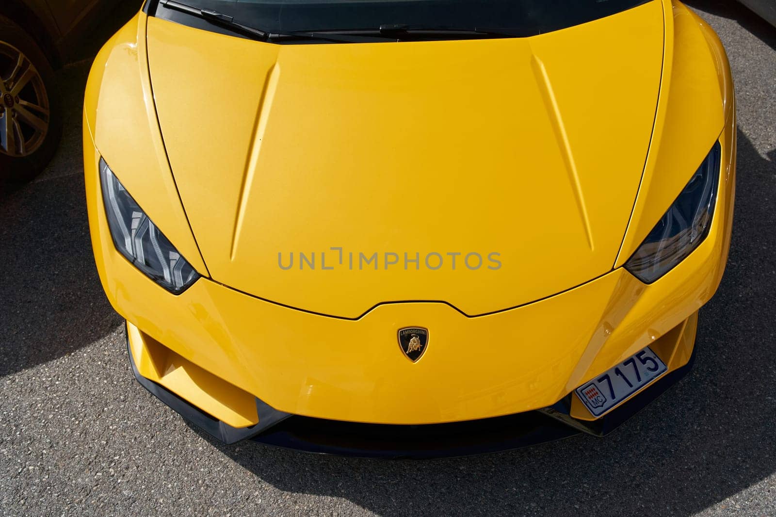 Monaco, Monte Carlo, 29 September 2022 - Close-up view of yellow sports car Lamborghini on street. High quality photo