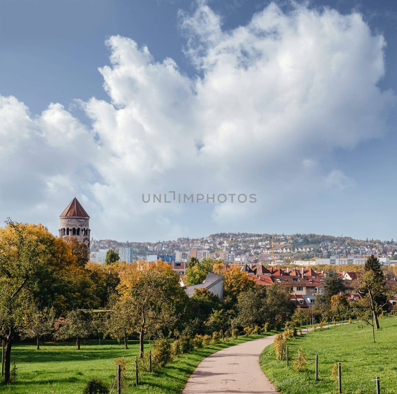 Germany, Stuttgart panorama view. Beautiful houses in autumn, Sky and nature landscape. Vineyards in Stuttgart - colorful wine growing region in the south of Germany with view over Neckar Valley. Germany, Stuttgart city panorama view above vineyards, industry, houses, streets, stadium and highway at sunset in warm orange light.