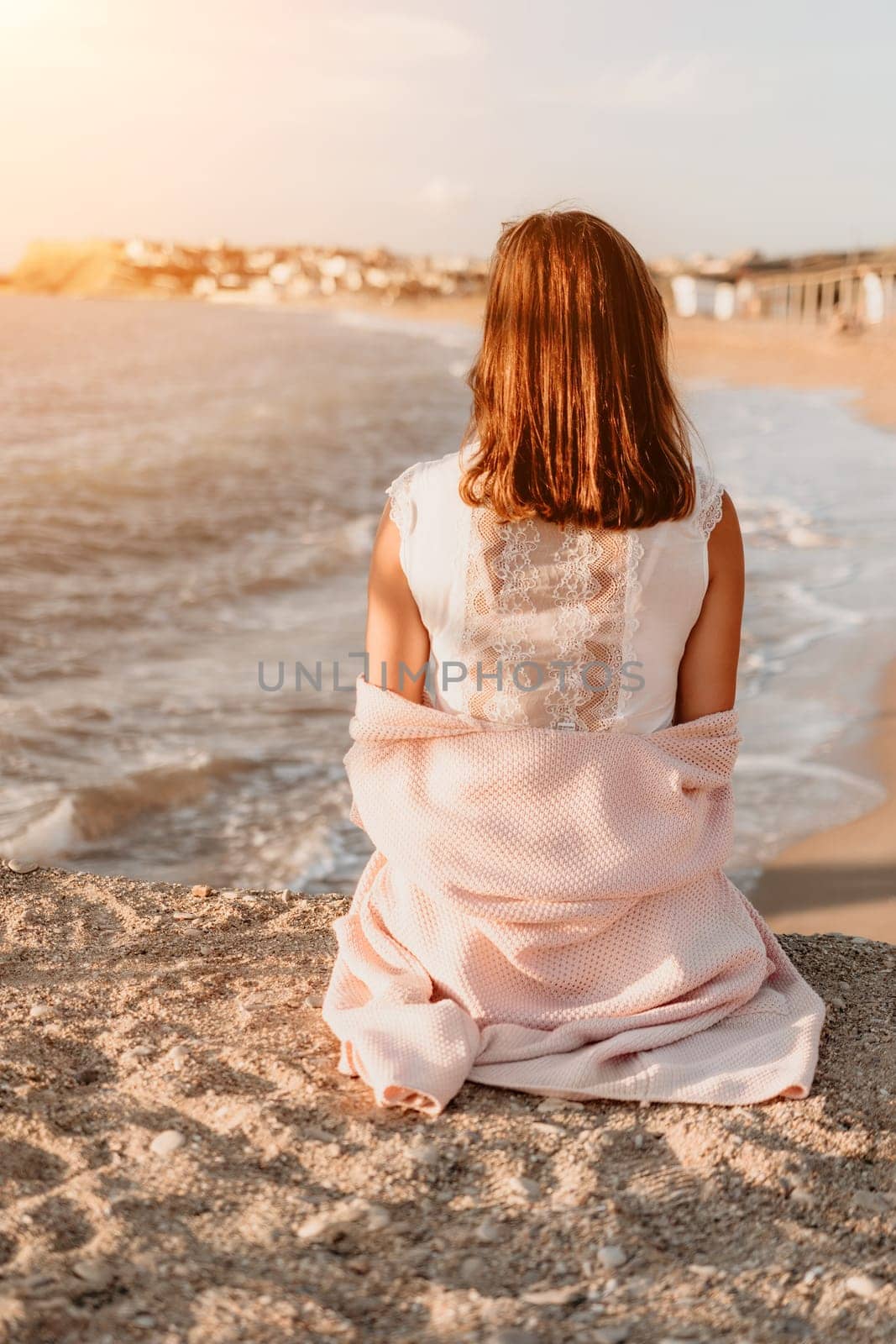 Woman summer travel sea. Happy tourist enjoy taking picture outdoors for memories. Carefree woman traveler posing on beach at sea on sunset, sharing travel adventure journey. Holiday vacation concept. by panophotograph