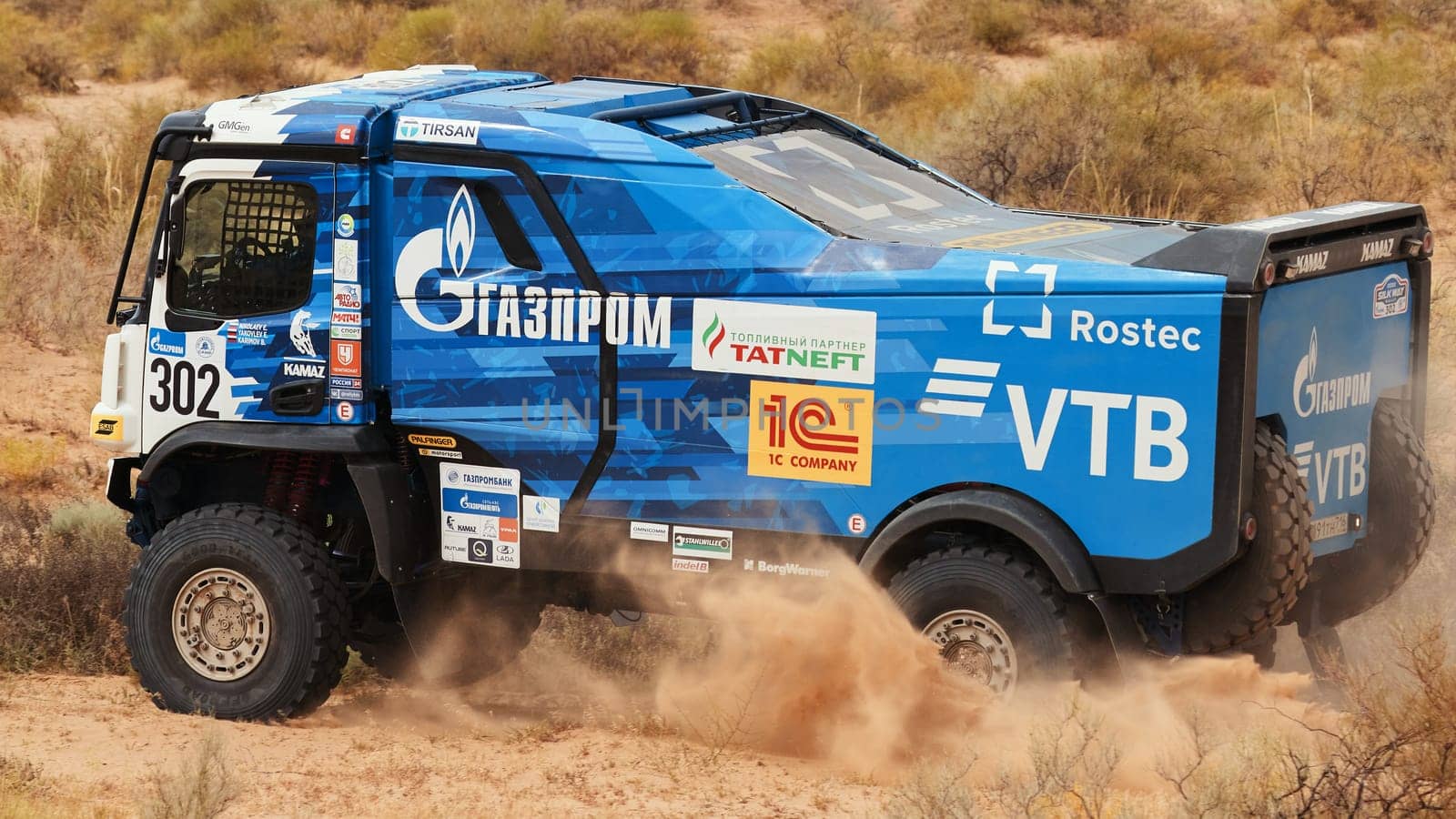 Extreme off-road racing. NEW Sports truck KAMAZ gets over the difficult part of the route during the Rally raid in sand. 14.07.2022 Kalmykia, Russia by EvgeniyQW