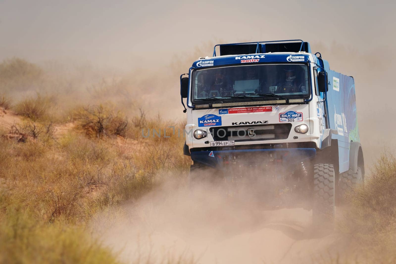 Extreme off-road racing. NEW Sports truck KAMAZ gets over the difficult part of the route during the Rally raid in sand. 14.07.2022 Kalmykia, Russia.