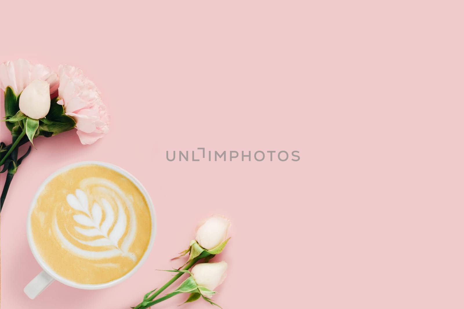 Tasty coffee surrounded by white roses on pink background.