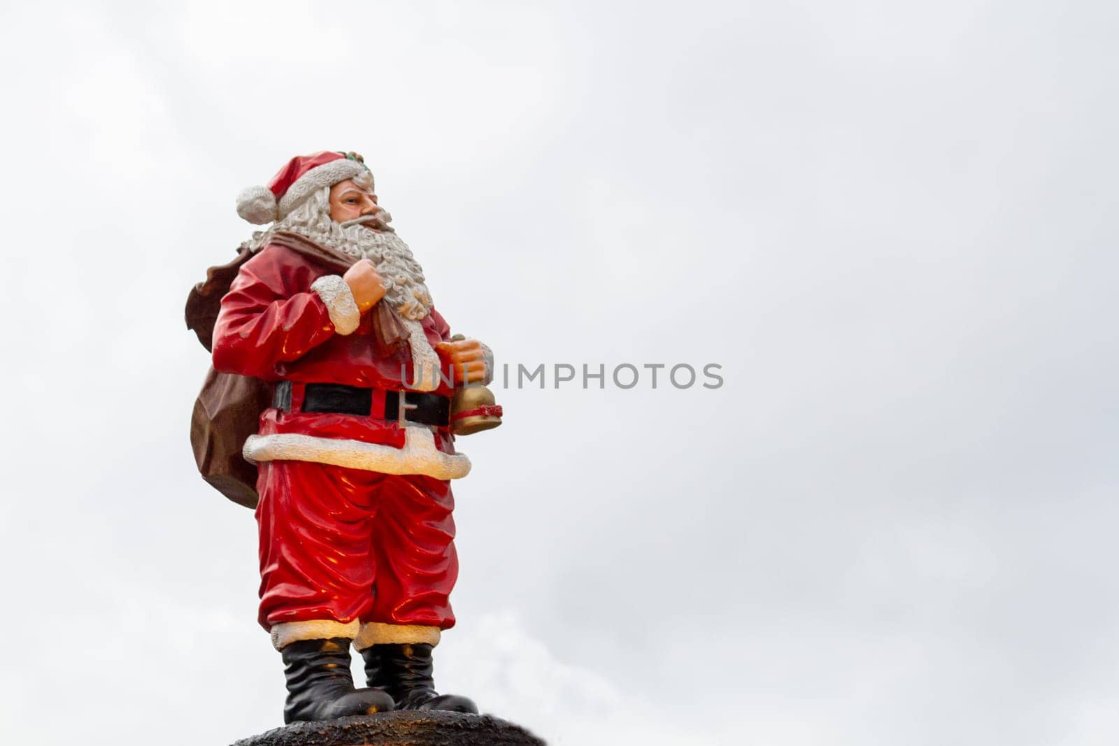 Santa Claus figurine overlooking the sky. High quality photo