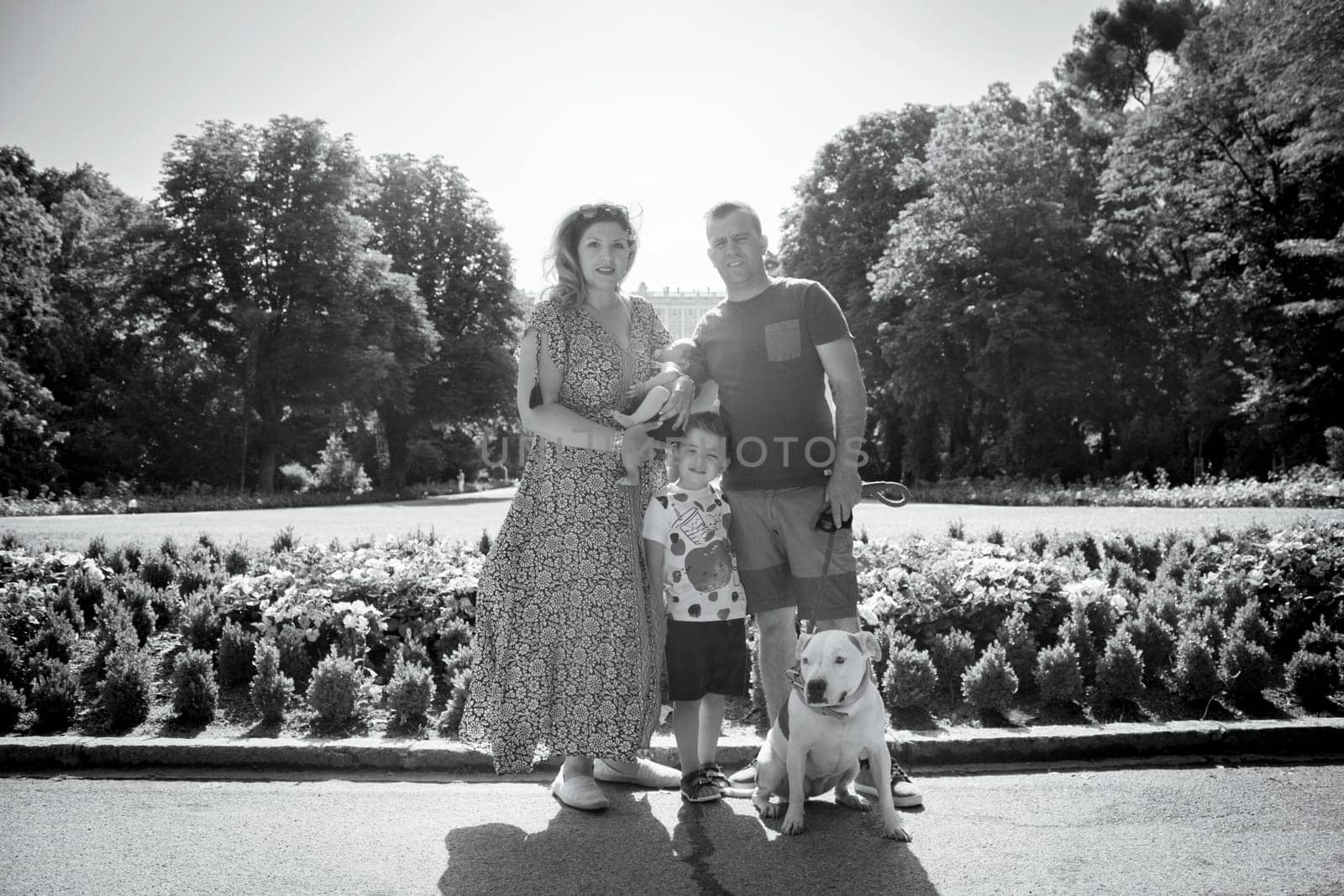 Family posing standing composed of parents, two children and a dog by GemaIbarra