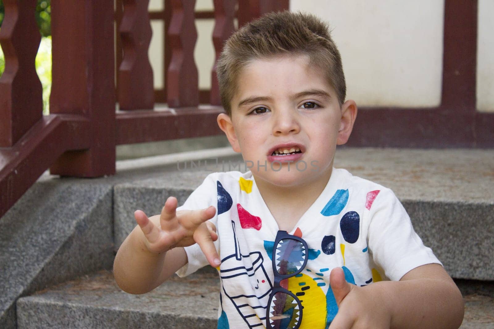 Four year old boy sitting gesturing by GemaIbarra