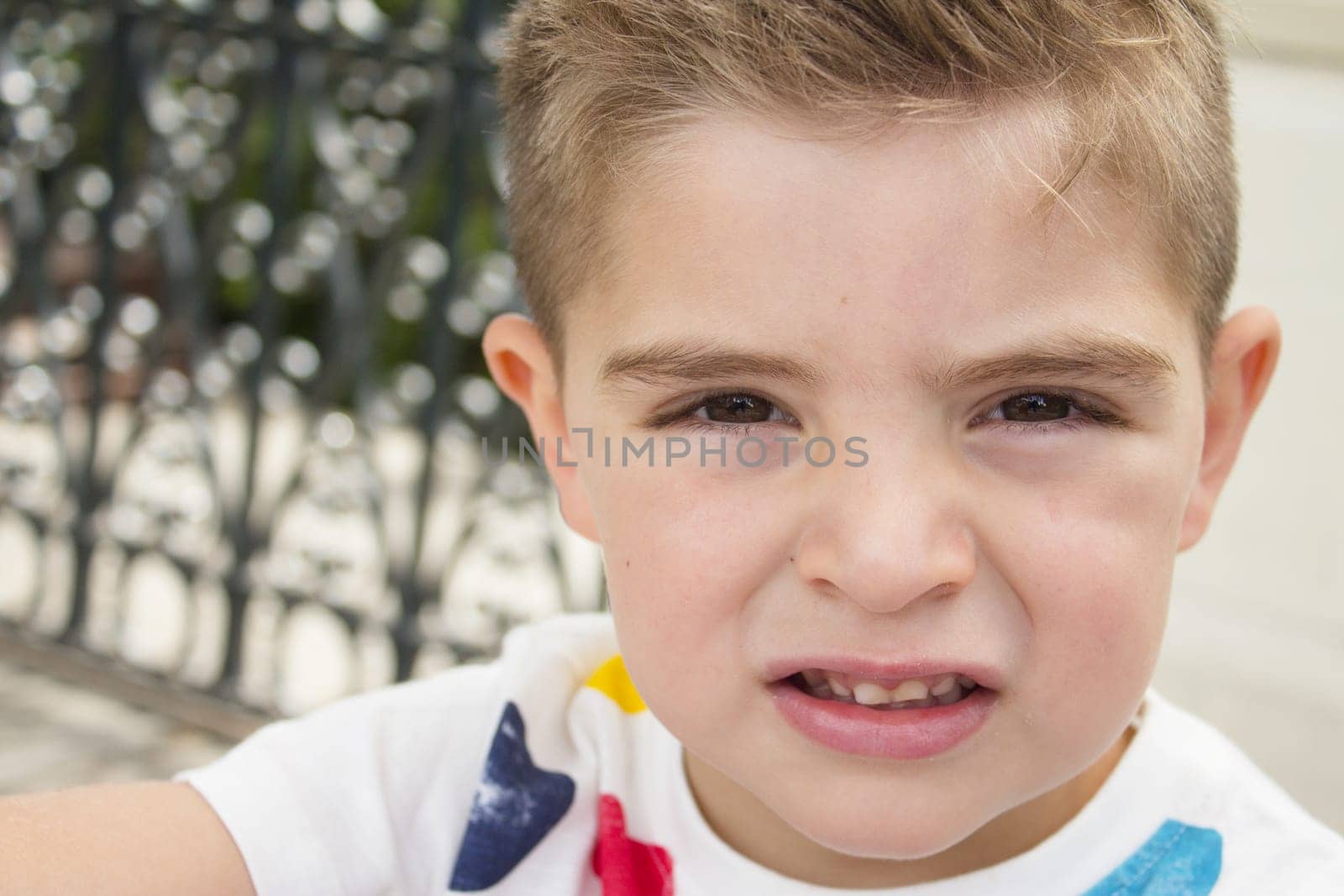 Portrait of four year old boy gesturing. One person