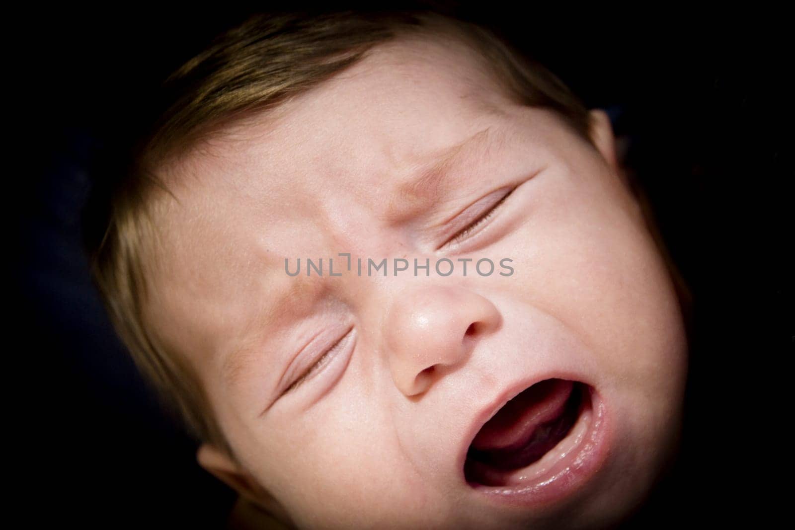 Two month old baby crying. So angry