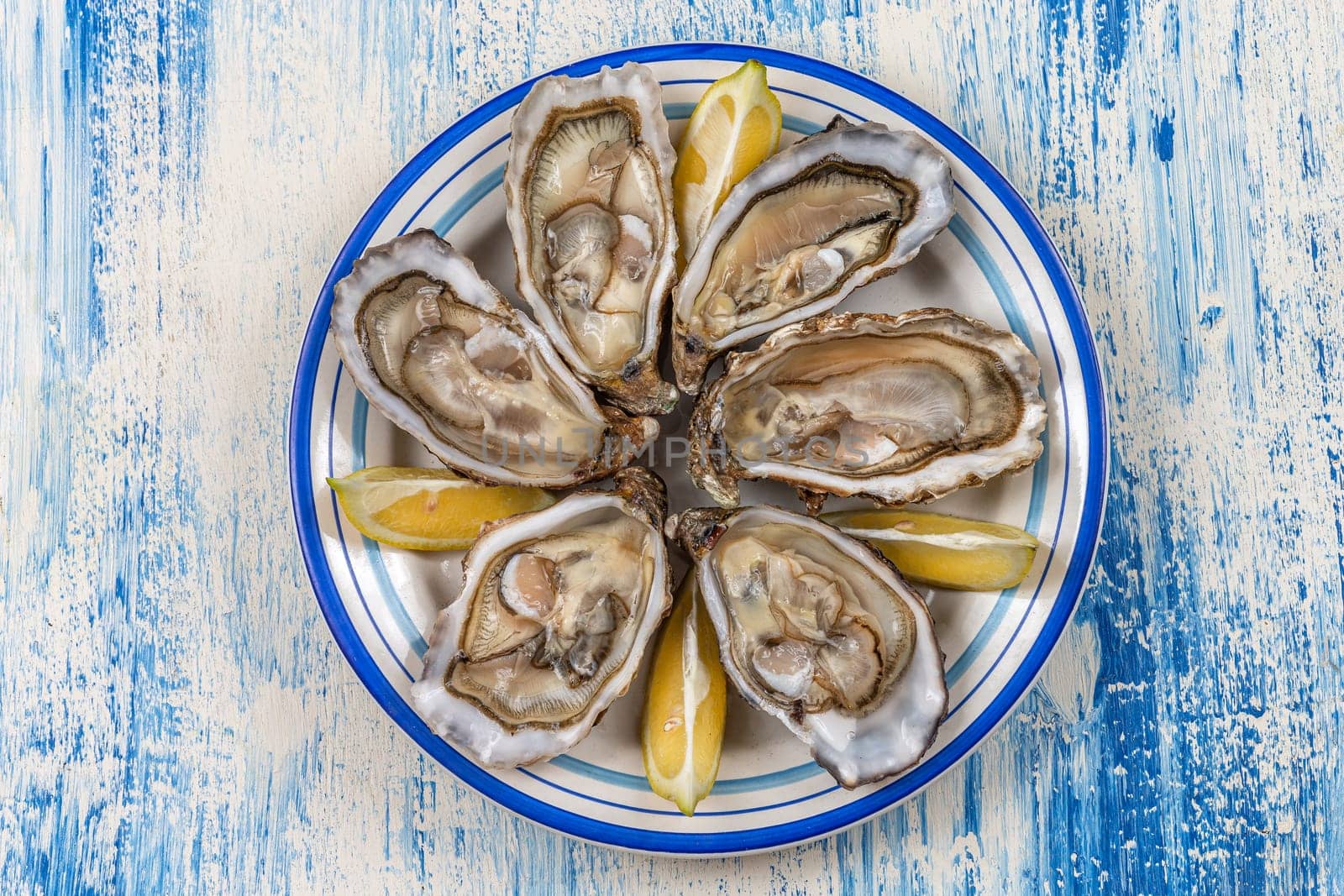 plate of oysters fresh seafood healthy meal on the table copy space food background rustic top view pescatarian diet by JPC-PROD