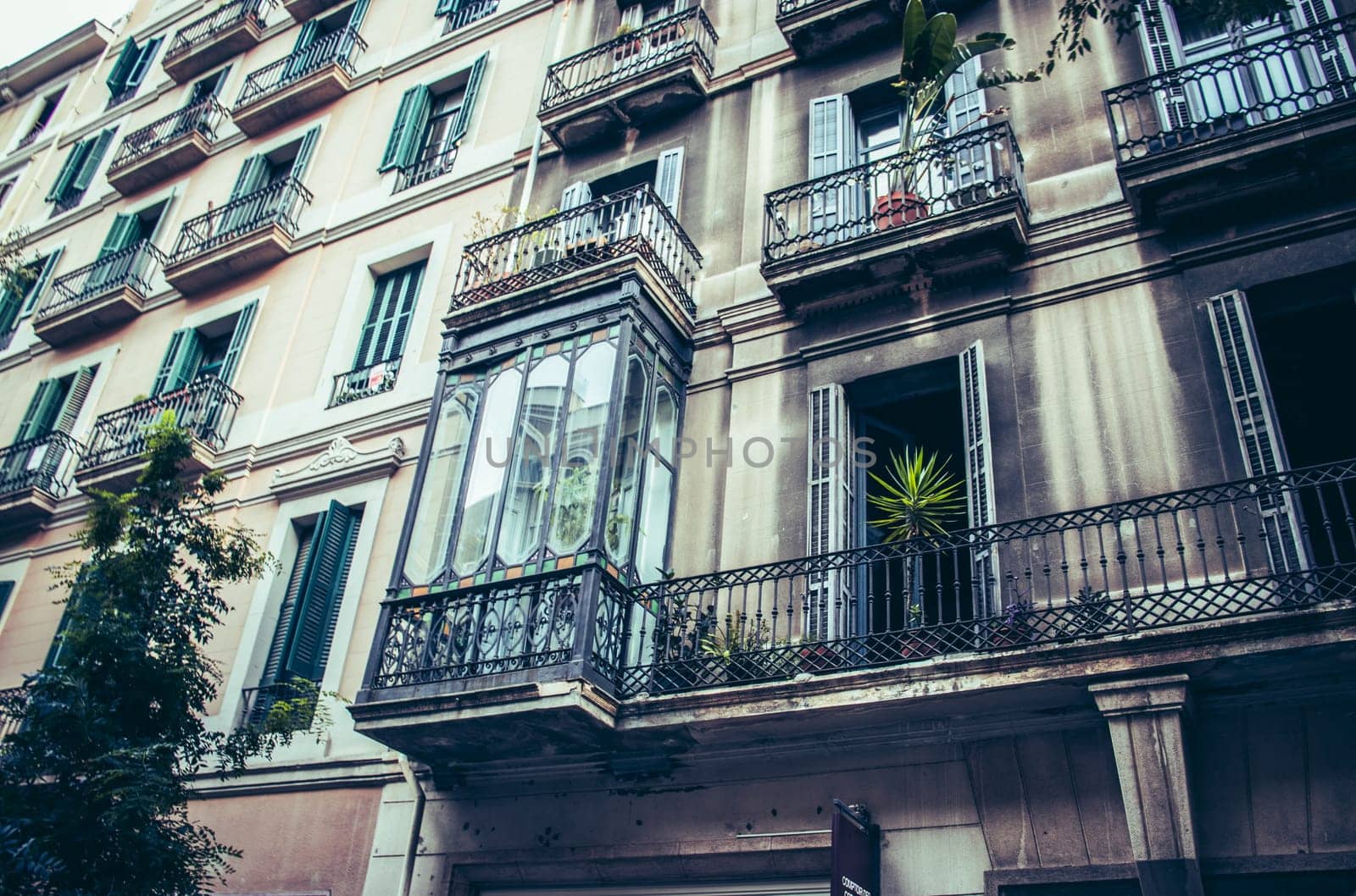 Facade of old apartment building with balcony, Barcelona, Catalonia. Spain photo. by _Nataly_Nati_