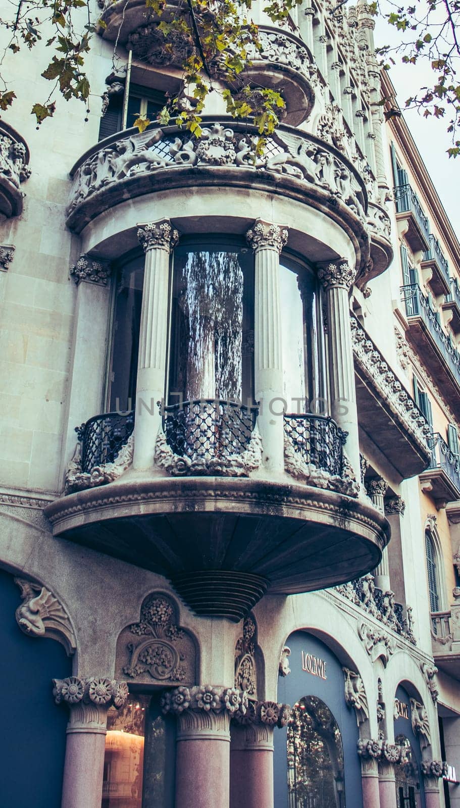 Historical apartment building with balcony, Catalonia. Street at sunset time in beautiful Barcelona. High quality picture for wallpaper, article