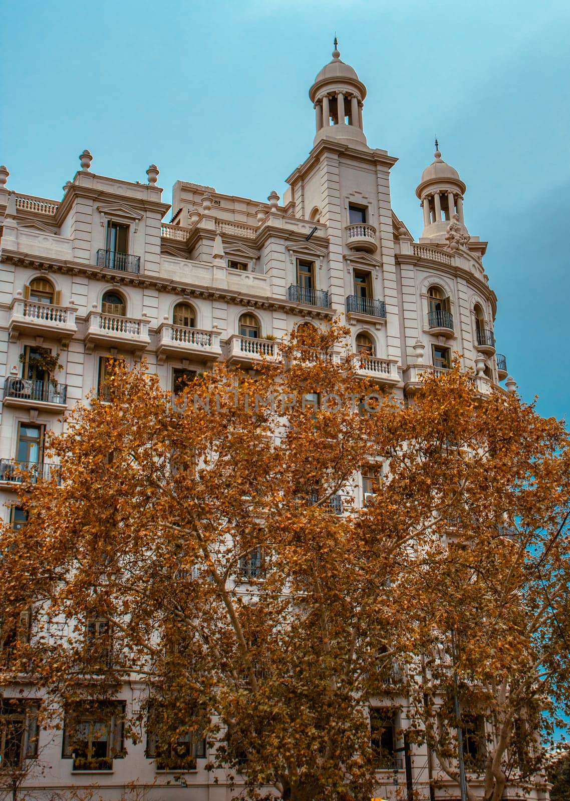 Historical apartment building in Europe city photo. Autumnal Barcelona, Catalonia. Beautiful urban scenery photography. Street scene. High quality picture for wallpaper, article