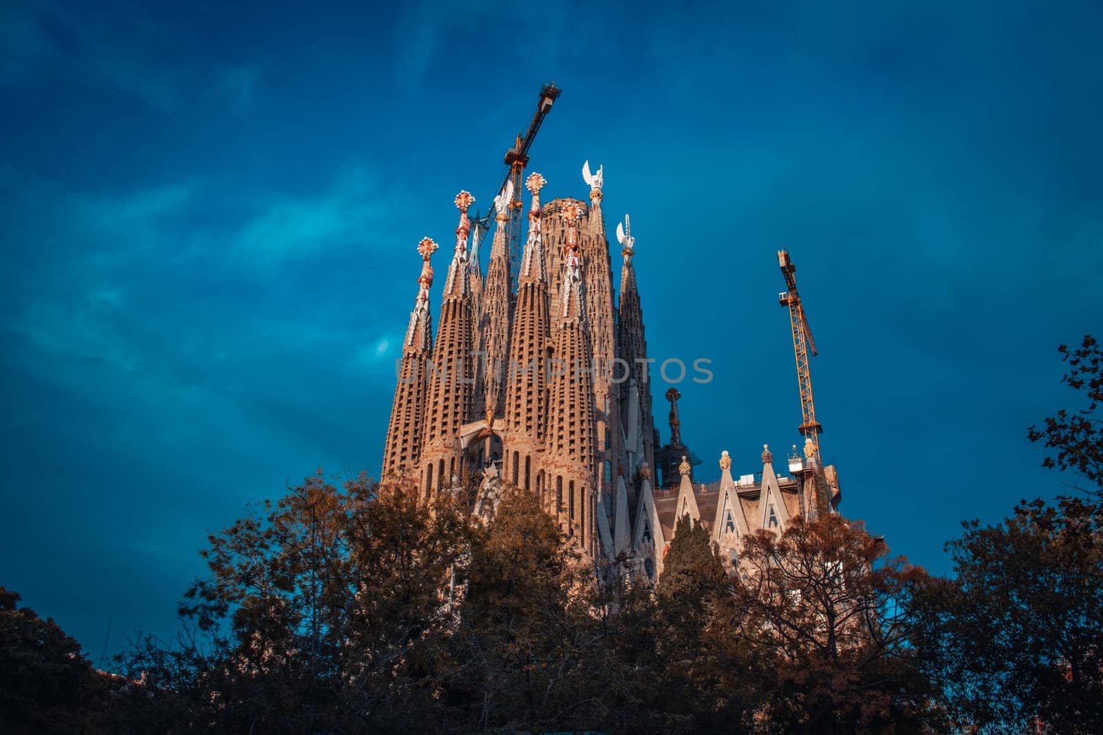 Sagrada Familia basilica in Barcelona concept photo. The Antoni Gaudi masterpiece. Beautiful urban scenery photography, street scene. High quality picture for wallpaper, article