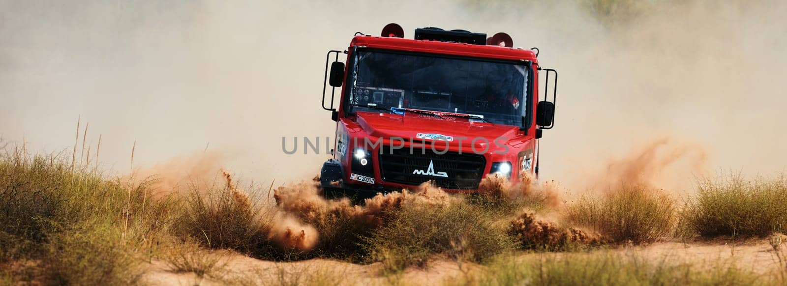 Extreme off-road racing. Sports truck MAZ Sport-auto team gets over the difficult part of the route during the Rally raid in sand. 14.07.2022 Kalmykia, Russia.