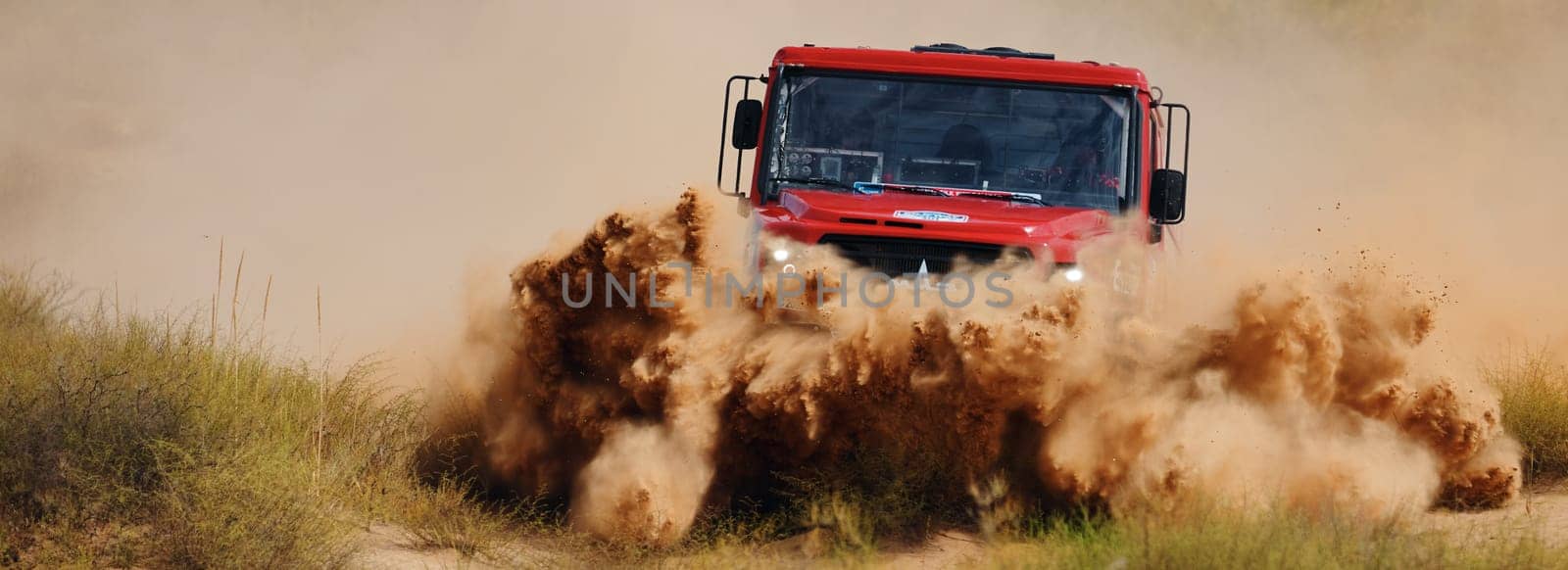 Extreme off-road racing. Sports truck MAZ Sport-auto team gets over the difficult part of the route during the Rally raid in sand. 14.07.2022 Kalmykia, Russia.