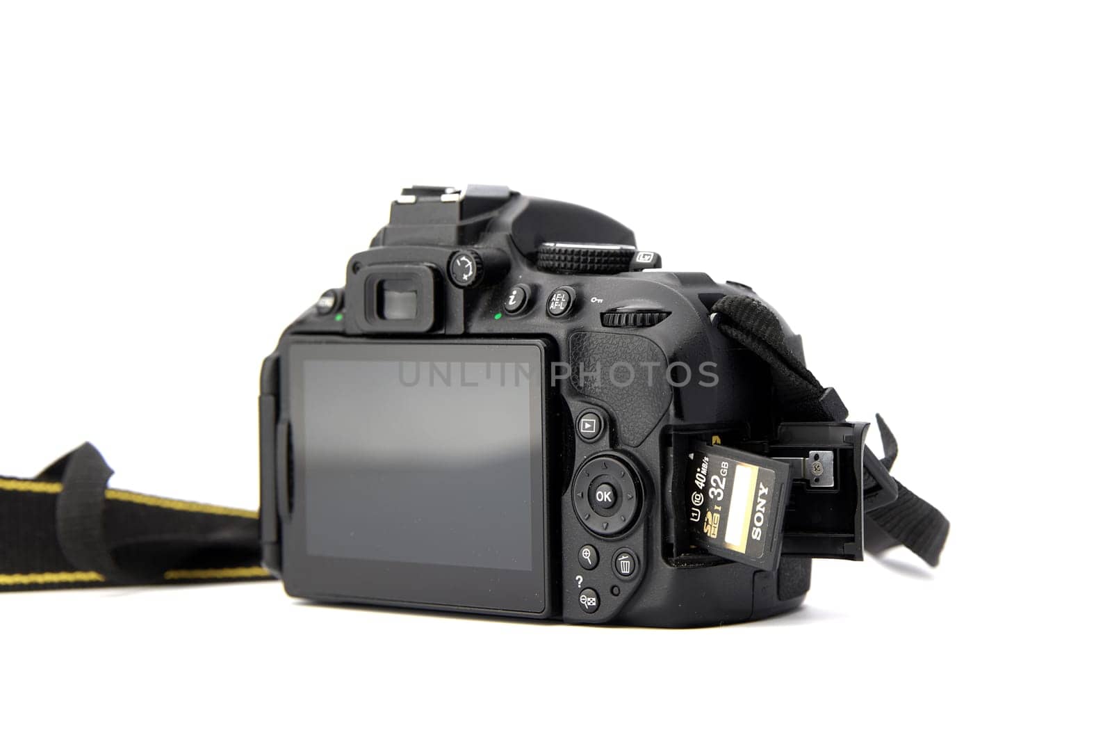 Nikon DSLR Camera Nikon D5300 with a memory card isolated on white background. Detail photos of Nikon D5300 body with grip. 03.04.2021, Rostov region, Russia by EvgeniyQW