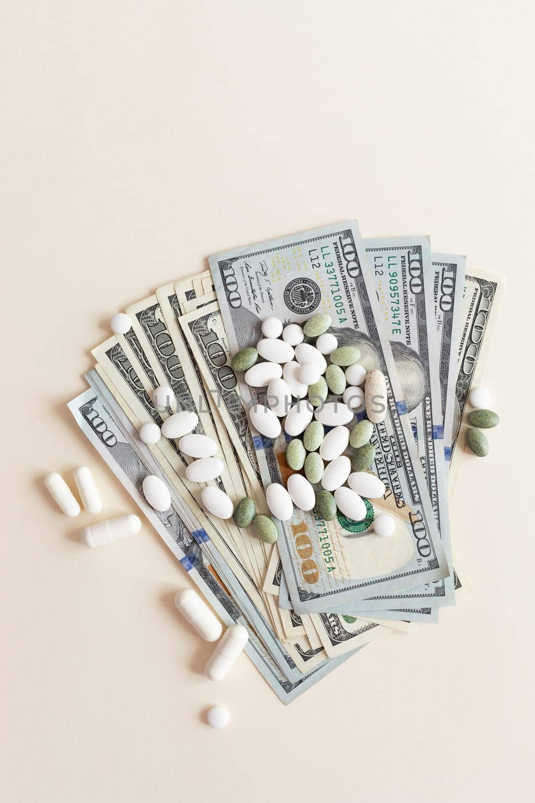 Many Dollar Money Banknotes And Different Pills Or Tablets. Space for Text. Expensive Medication And Healthcare Insurances. Inflation. Pharmaceutical Industry And Big Pharma. Vertical Plane.