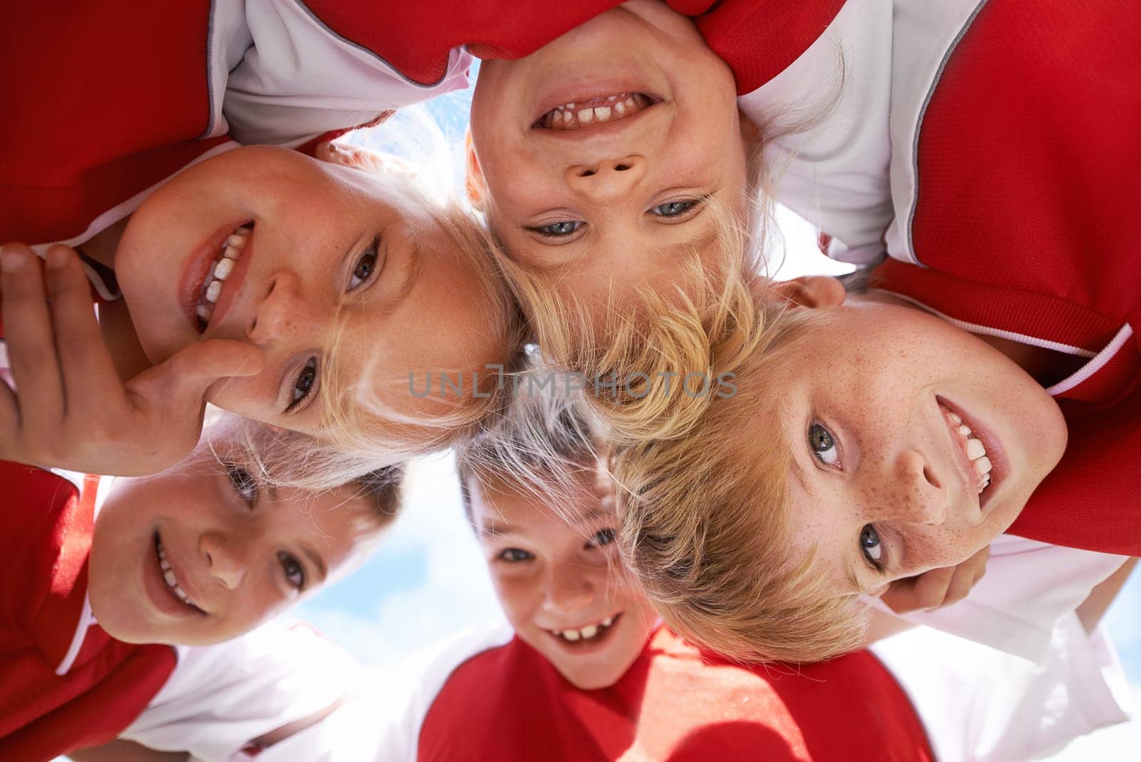 Children, portrait and soccer team huddle in outdoors, happy and collaboration or support. People, kids and boys together for match and partnership, smiling and solidarity in circle by sky background.