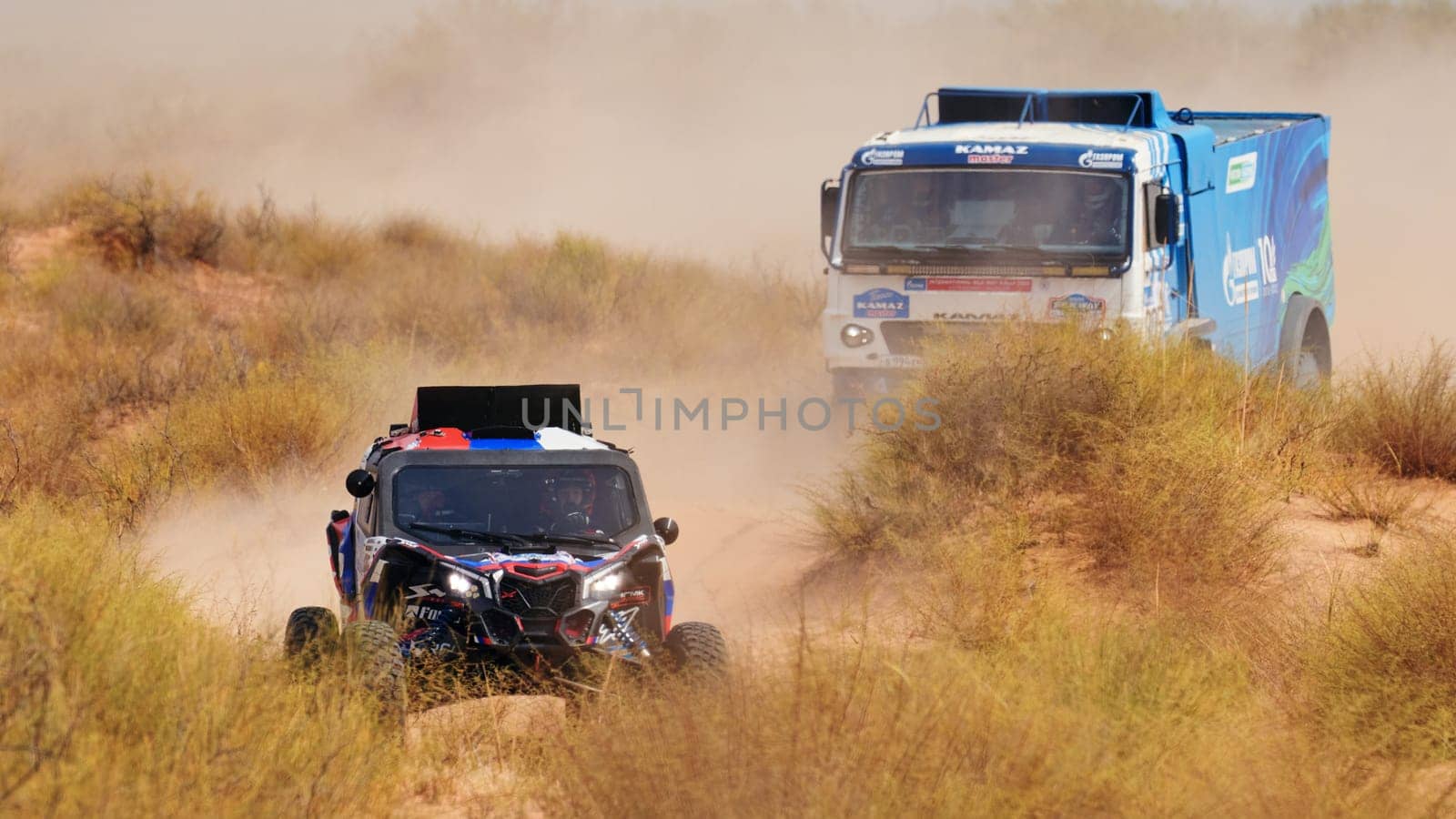 Extreme off-road racing. Sports car gets over the difficult part of the route during the Rally raid in sand. 14.07.2022 Kalmykia, Russia by EvgeniyQW